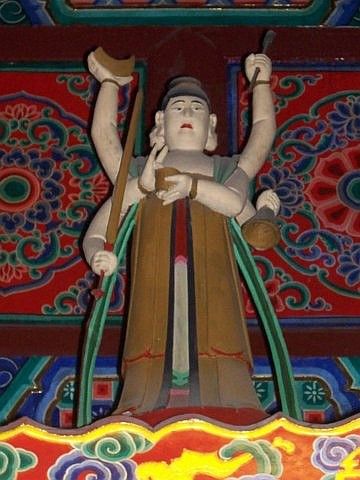 Leshan Buddhist site - Buddhist deity with six arms in Wuyou temple