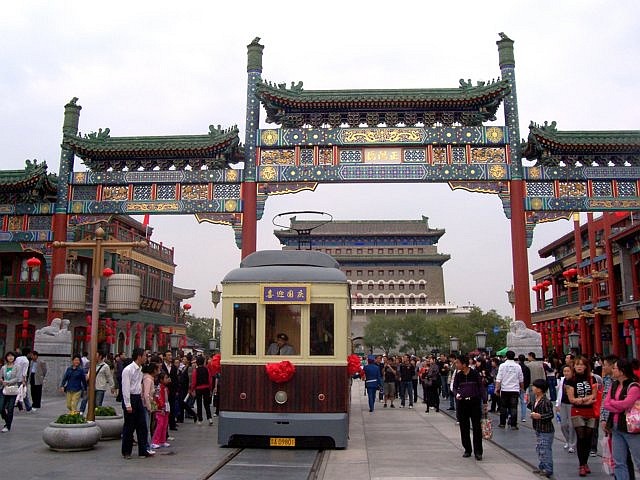 Qianmen street - Tram in front of a Paifang near Qianmen square